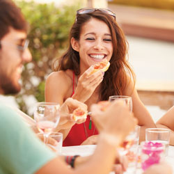 Group of people enjoying a meal.