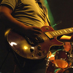 Man playing guitar on stage