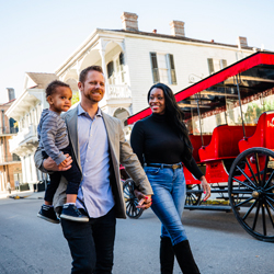 Family walking down Bourbon Street